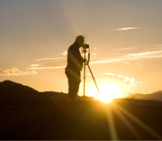 photographer (not Brian!) on a hill during a beautiful sunset